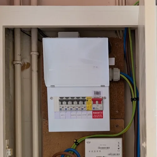 New consumer unit installed in a meter cupboard in Poole
