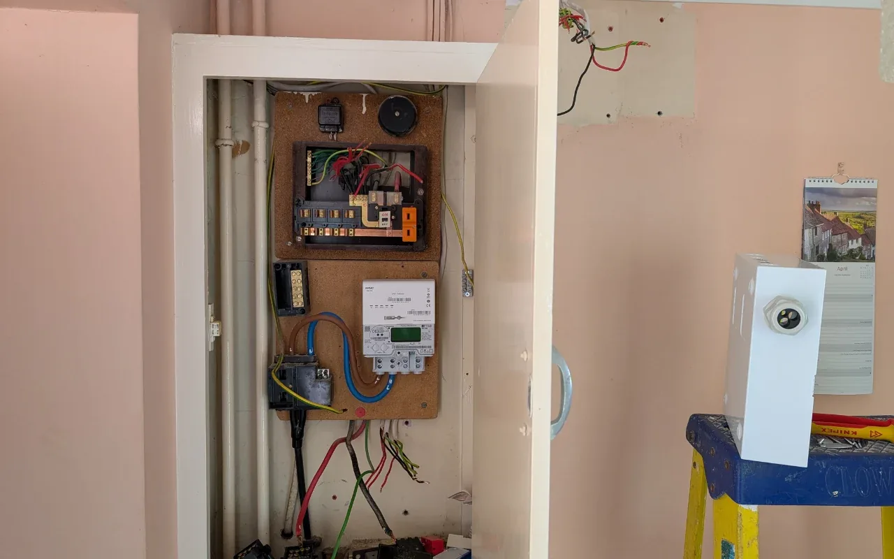 Consumer unit upgrade in progress with the busbar exposed
