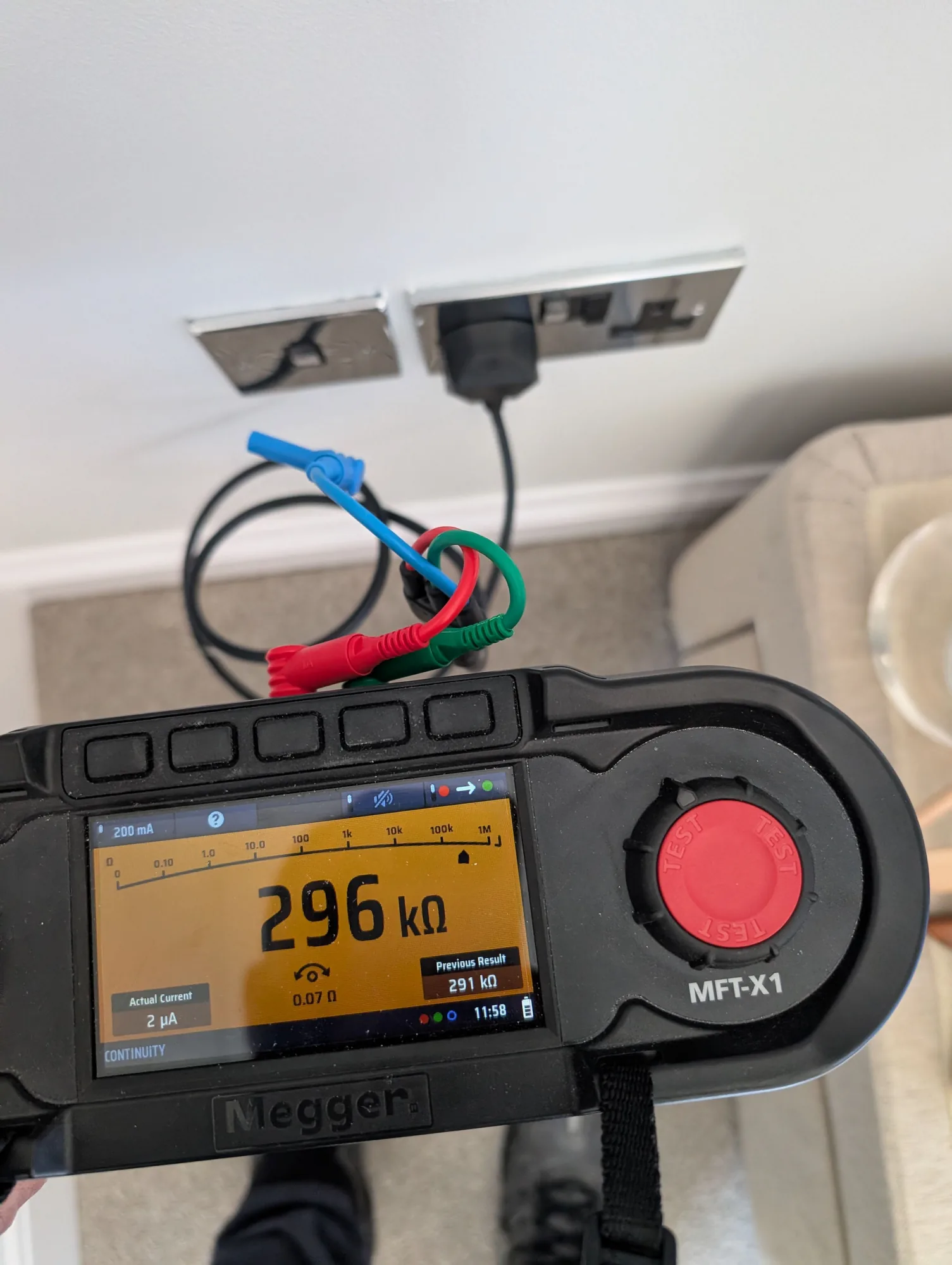 Insulation and continuity testing at a socket outlet