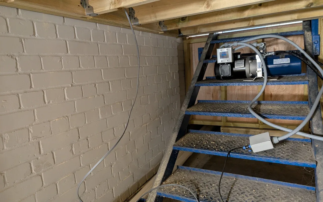 Pump control wiring installed in a sub-floor void